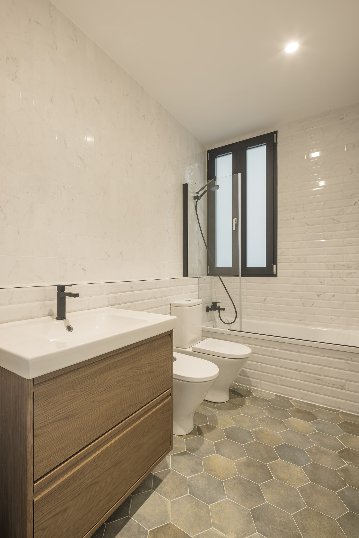 Reforma de piso estilo Clásico contemporáneo en Gràcia, Barcelona
