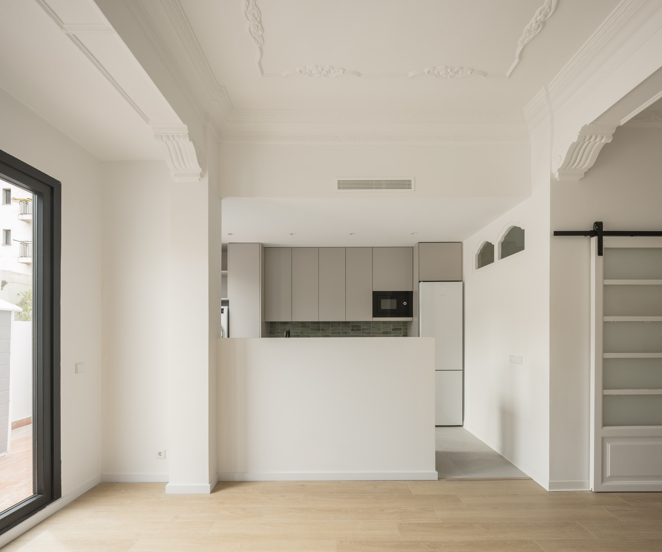 Reforma de piso estilo Clásico contemporáneo en Gràcia, Barcelona